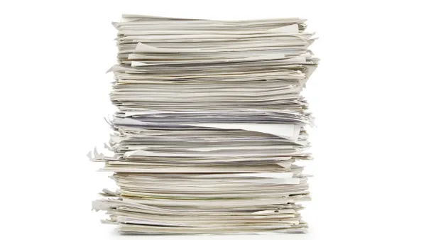 Large stack of papers on a white background