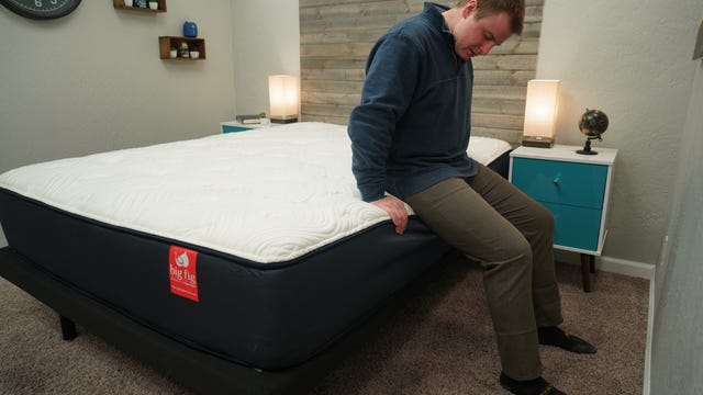 Dillon testing the edge support on the Big Fig mattress.