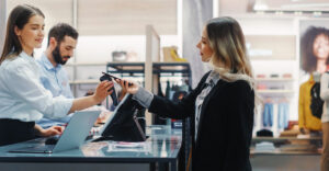 shopper using a digital wallet at a retail checkout counter