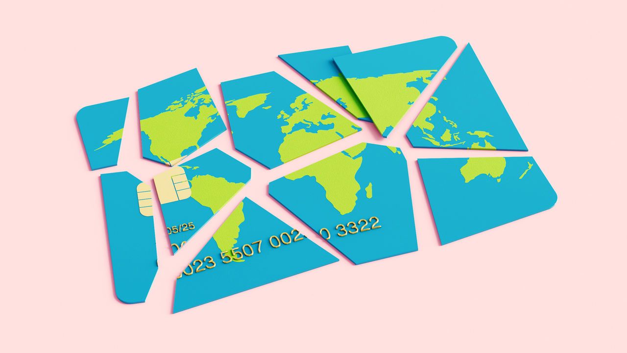 A debit card with the image of a world map that's been fractured and broken up