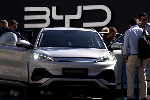 Visitors check the China made BYD ATTO 3 at the IAA motor show in Munich, Germany, on Sept