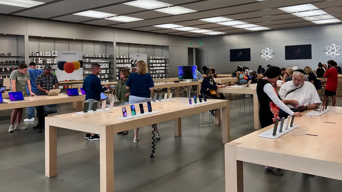 People mill around an Apple store at location in Maryland.