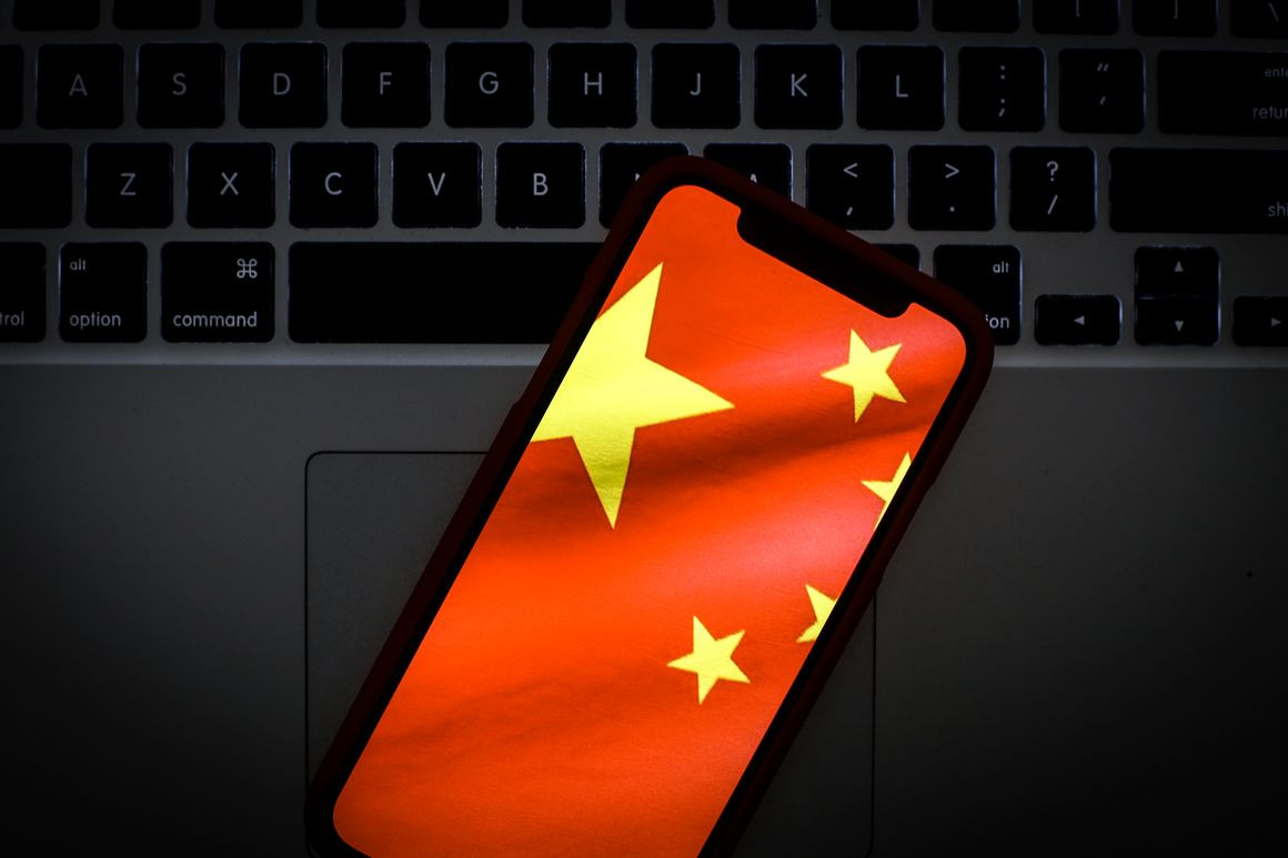 The Chinese flag is seen on a portable mobile device in this photo illustration.