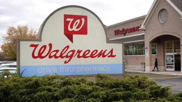 The Walgreens logo is displayed outside a store.