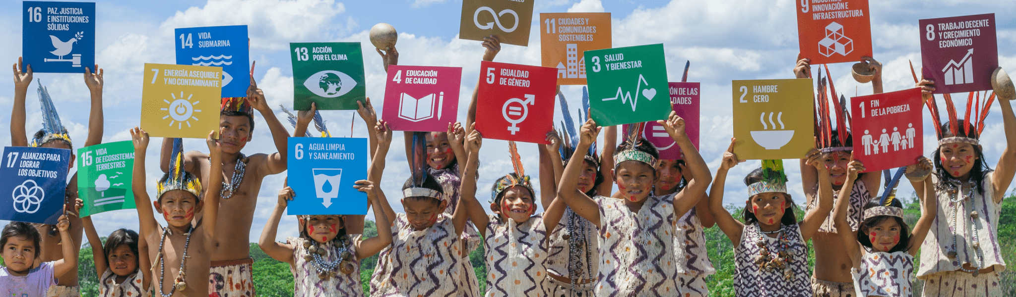 presentation image of children holding signs of each of the 17 development goals